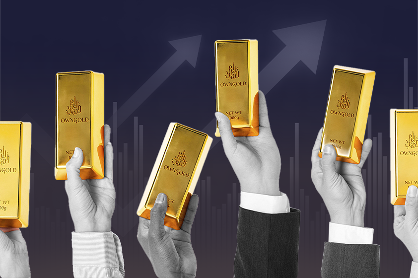 Gold investment news: Hands holding up gold bars